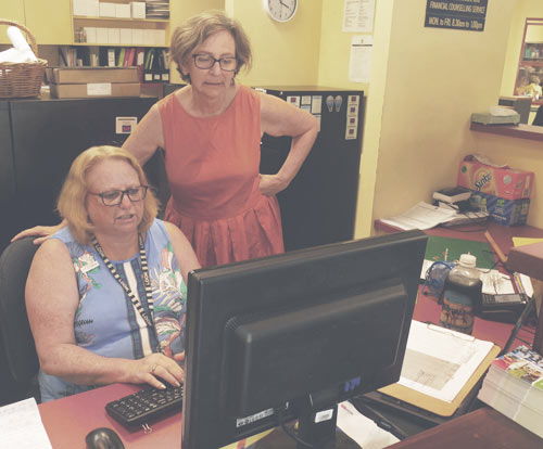 Image of two women working in an office